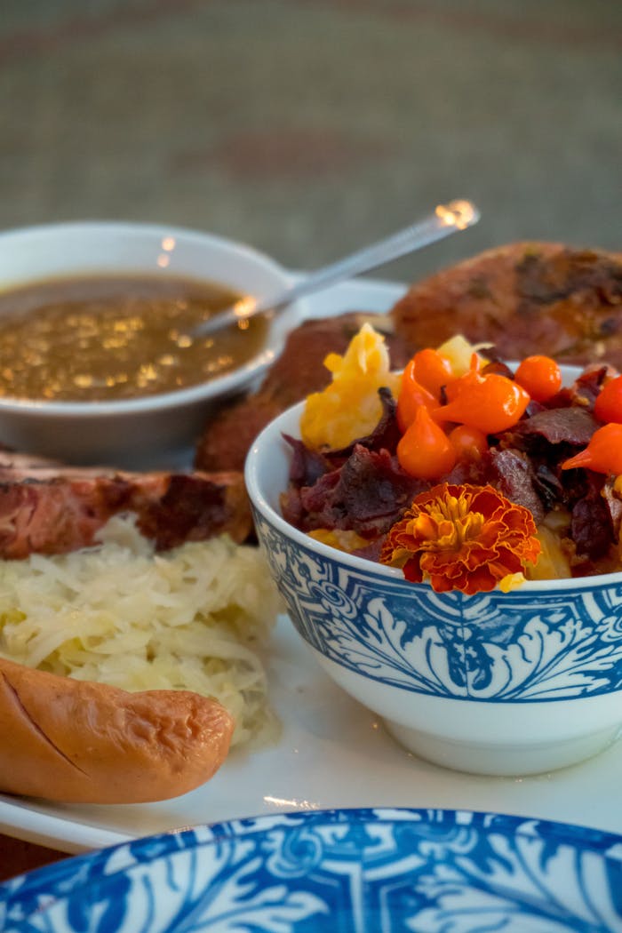 A vibrant still life of German-inspired dishes featuring sausage and sauerkraut. Perfect for food enthusiasts.